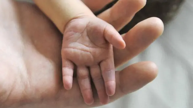 Newborn baby's hand