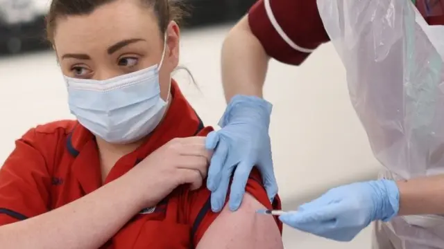 Health worker receiving the Covid-19 vaccination