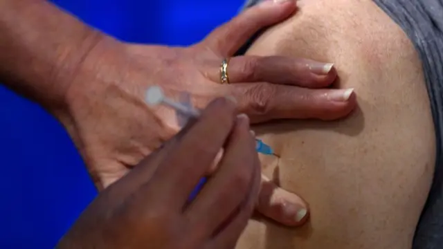 Vaccine being administered