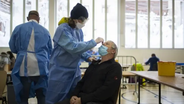 A man is tested at a centre in Switzerland