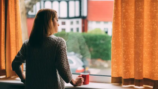 Woman self-isolating (file image)