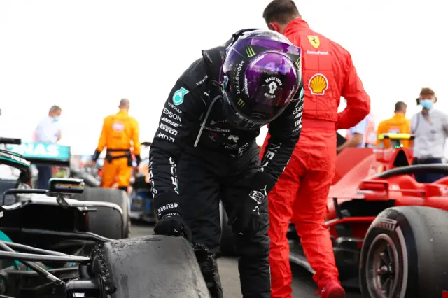 Lewis Hamilton checks his tyres after the end of the British Grand Prix