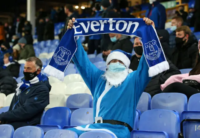 An Everton fan dressed as Santa watching Saturday's game against Chelsea