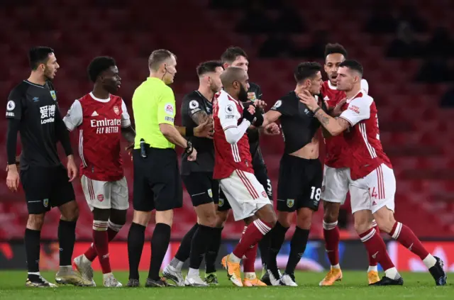 Granit Xhaka grabbing Ashley Westwood by the throat - an incident that led to him being sent off