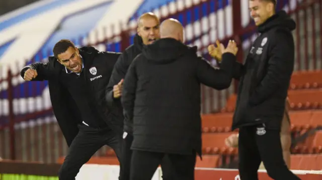 Barnsley bench celebrates goal