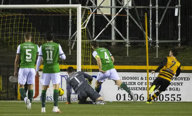 The ball ricochets off Hibernian's Paul Hanlon (centre) to make it 1-0 to Alloa