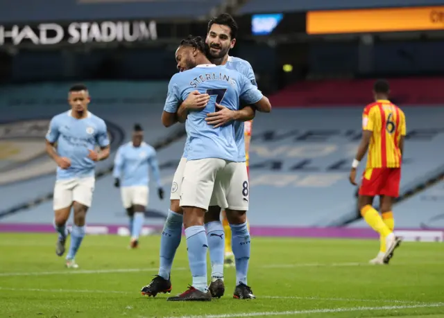 Ilkay Gundogan and Raheem Sterling