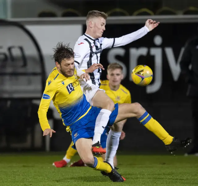 Dunfermline's Kyle Turner is challenged by St Johnstone's Murray Davidson