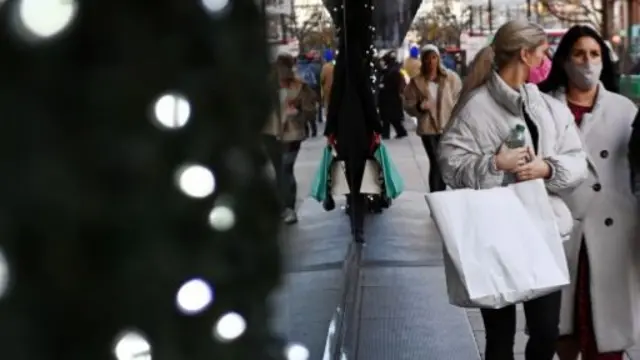 Christmas lights and people in masks