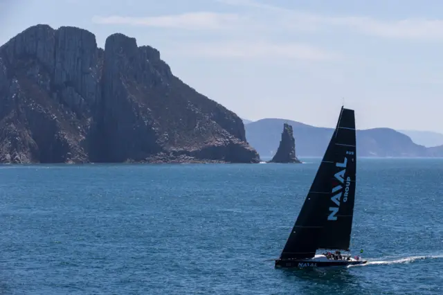 Naval Group passing Tasmin island on December 28, 2019 during the Sydney to Hobart in Hobart, Australia. Photo by Andrea Francolini/Getty Images