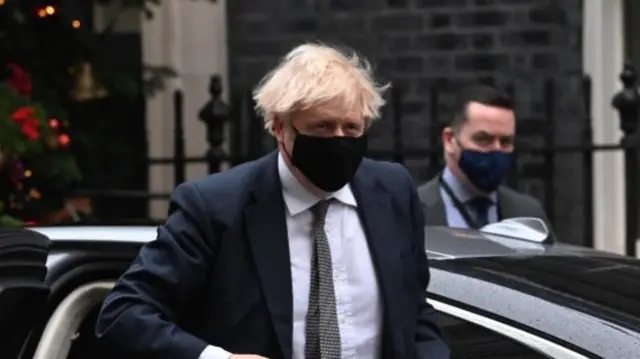 Boris Johnson getting out of his car on Downing Street