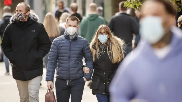 People wearing masks in Leeds