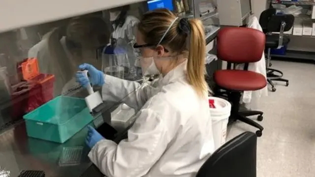 An employee works at the Pfizer laboratories where they conduct research and development on a coronavirus disease (COVID-19) vaccine in Pearl River, New York, U.S., in this undated handout photo. Pfizer/Handout via REUTERS