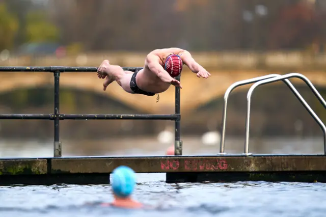 A swimmer takes to the water at the Serpentine Club