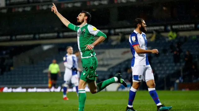 Scott Malone celebrates after scoring an equaliser for Millwall against Blackburn