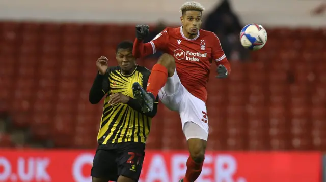 Nottingham Forest's Lyle Taylor battles with Christian Kabasele of Watford