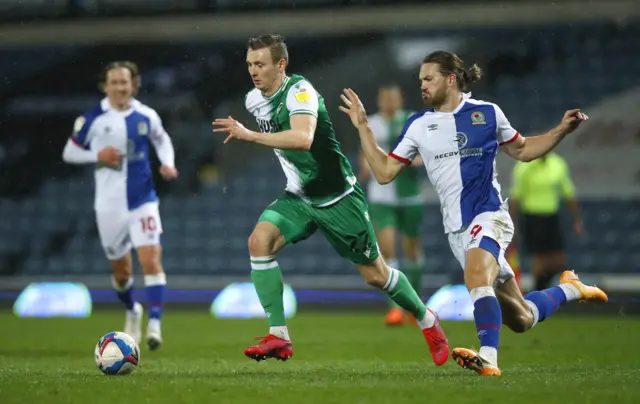 Jon Davi Bodvarsson of Millwall is challenged by Sam Gallagher of Blackburn Rovers