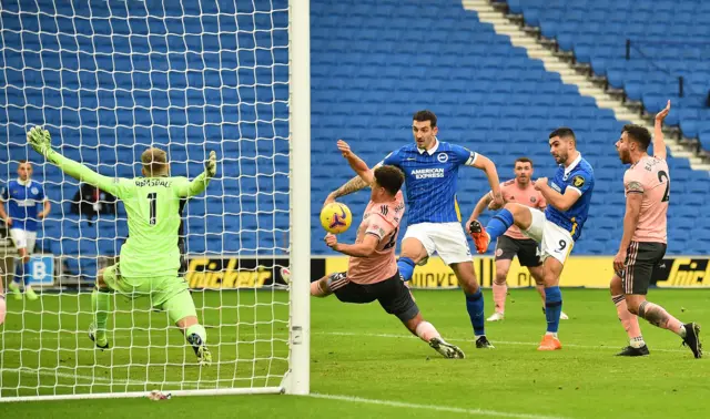 Lewis Dunk pokes over the bar