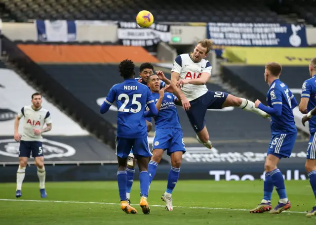 Tottenham's Harry Kane heads towards goal against Leicester