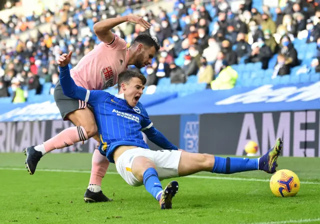 George Baldock fouls Solly March