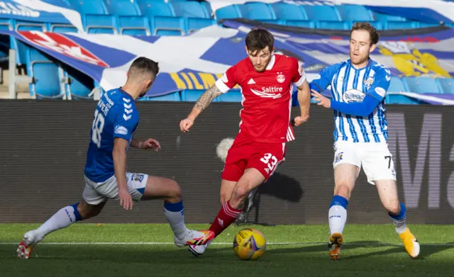 Aberdeen's Matty Kennedy is challenged by Kilmarnock's Calum Waters and Rory McKenzie