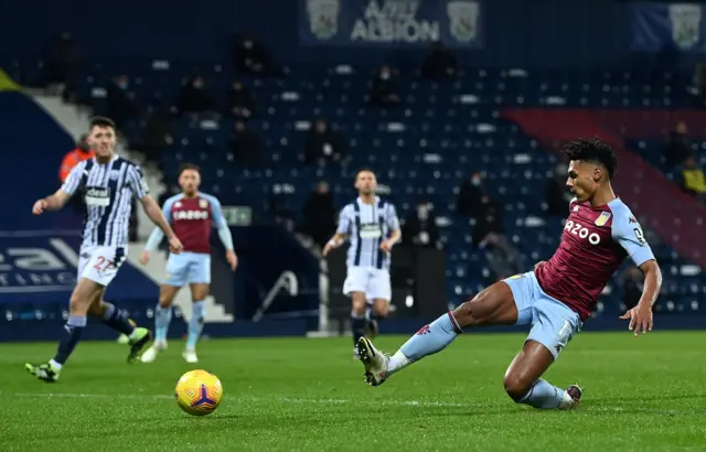 Aston Villa's Ollie Watkins slides in their second goal against West Brom, but it is later disallowed by VAR for offside