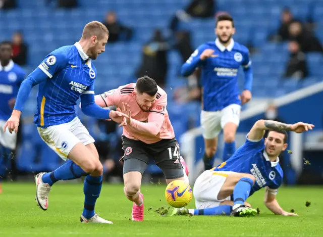 Lewis Dunk fouls Olivier Burke