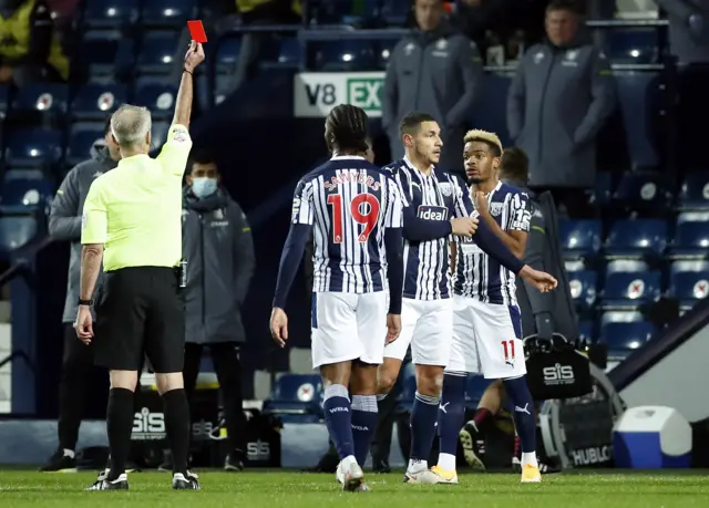 West Brom's Jake Livermore is shown a red card by Martin Atkinson in their Premier League game against Aston Villa