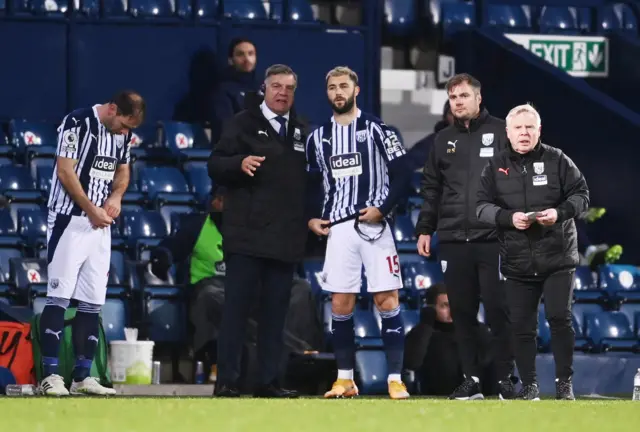 West Brom's Charlie Austin receives instructions from Sam Allardyce ahead of coming on