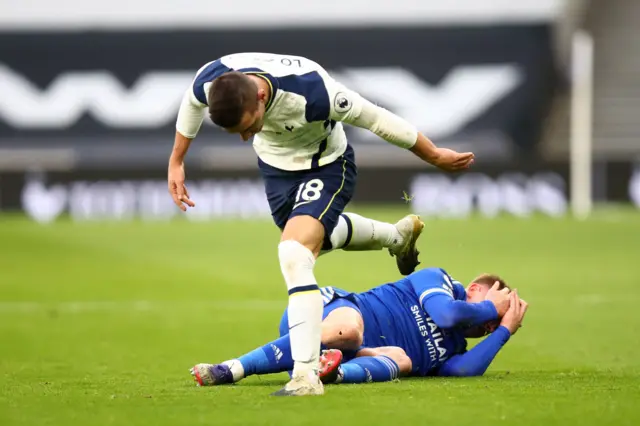 Tottenham's Giovanni La Celso fouls Leicester's Harvey Barnes