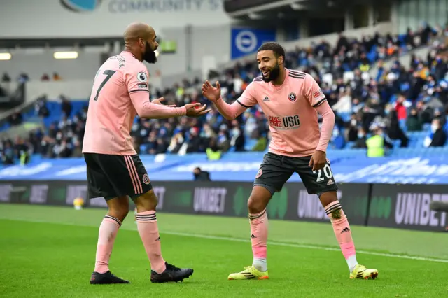 Jayden Bogle and David McGoldrick celebrate