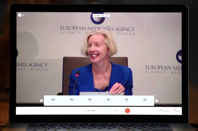 A photo taken off the screen of a laptop shows Emer Cooke, CEO of the European Medicines Agency (EMA), explaining the approval of the Pfizer-BioNTech coronavirus vaccine during an online press conference in Amsterdam, The Netherlands, on 21 December 2020