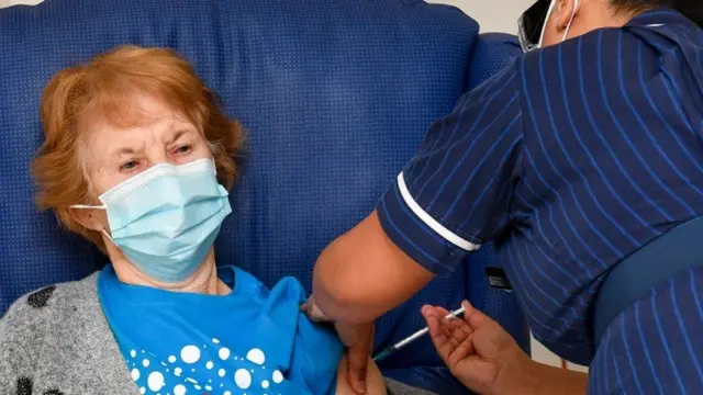 Woman getting vaccine