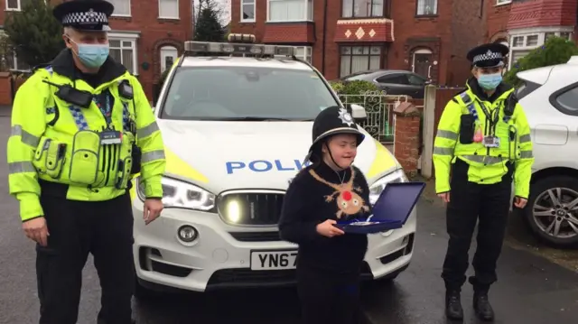 Emily with police officers