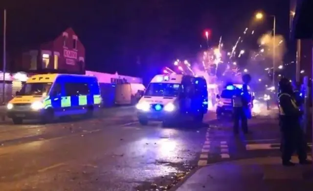 Officers in riot gear in the Harehills area of Leeds