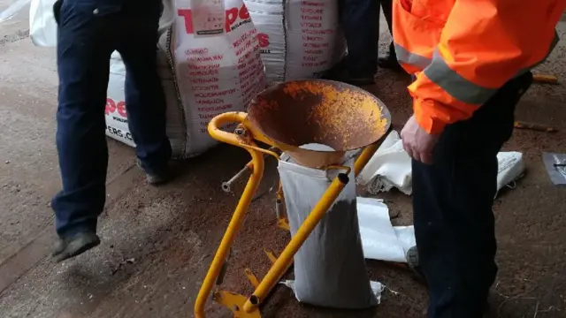 Sandbags being prepared