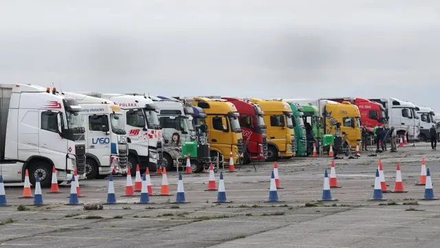 Freight lorries lined up at the front of the queue on the runway at Manston Airport,