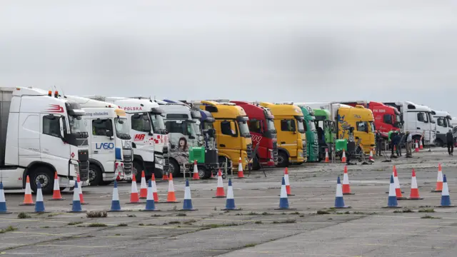 Freight lorries lined up at the front of the queue on the runway at Manston Airport, Kent,