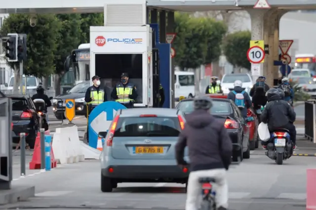 Several vehicles cross the Gibraltar border from Spanish side, in the town of La Linea de la Concepcion, southern Spain, 22 December 2020