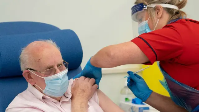 A man getting the Pfizer-BioNTech vaccine