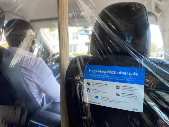 A plastic divide in an Uber car in New York