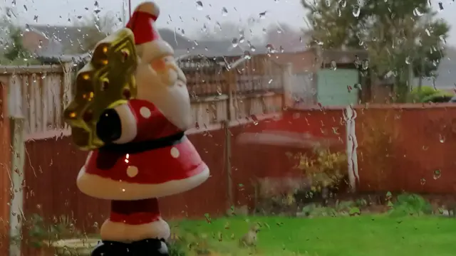 Santa decoration and wet window in Chellaston