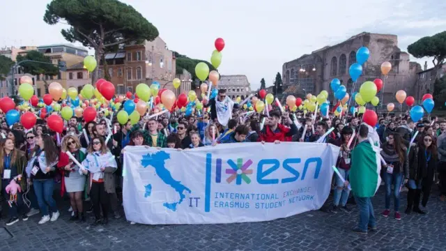 Students holding an Erasmus sign