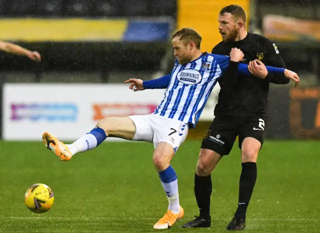 Kilmarnock's Rory McKenzie is held by Livingston's Nicky Devlin