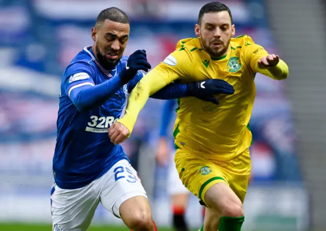 Rangers' Kemar Roofe and Hibernian's Drey Wright vie for possession