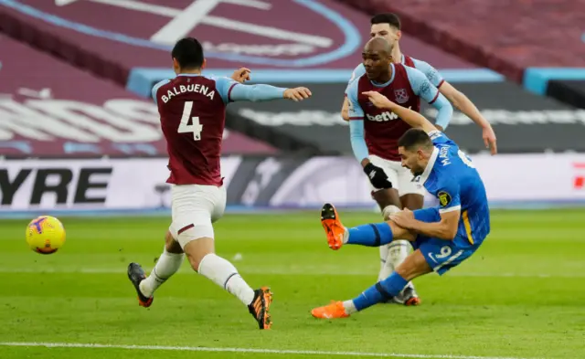 Brighton's Neal Maupay scores the opening goal against West Ham at London Stadium