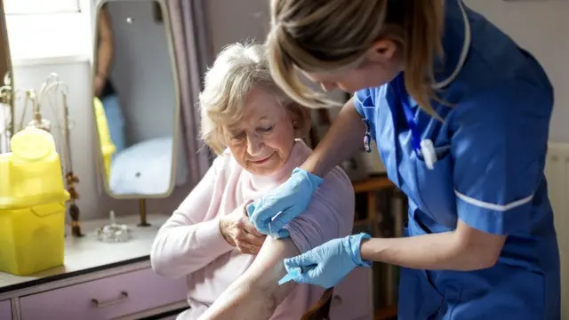 A woman having a vaccine