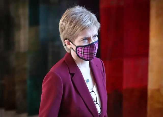 First Minister Nicola Sturgeon arrives to give an update on Covid restrictions in the Scottish Parliament, Edinburgh.