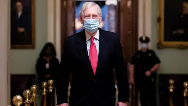 US Senate Majority Leader Mitch McConnell walks near the Senate floor on Capitol Hill in Washington, DC, USA, 21 December 2020.