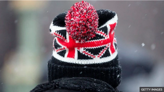 Creative image of man wearing Union flag hat